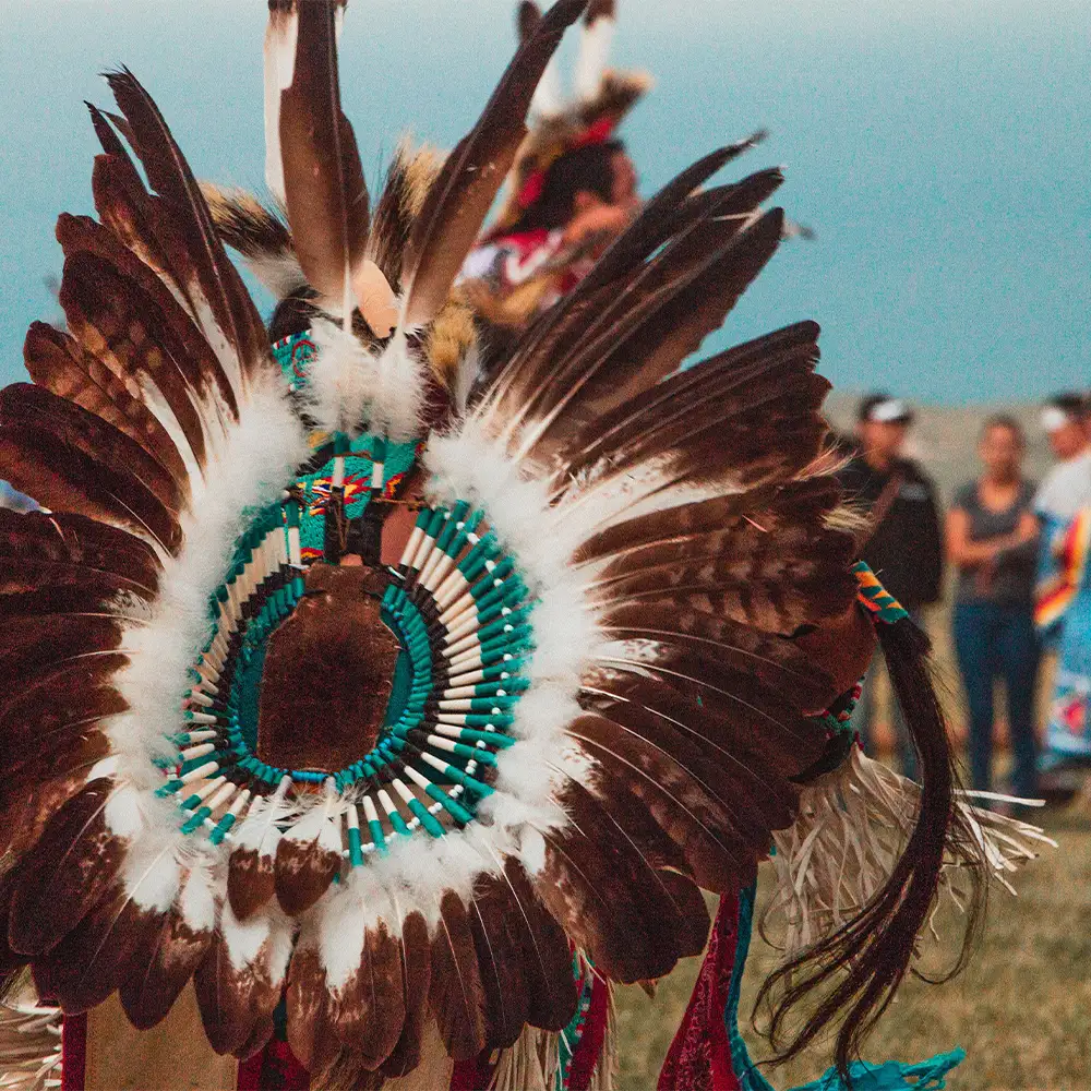 indigenous person in dancing regalia